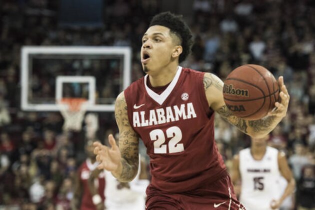 Alabama guard Ar'Mond Davis (22) drives to the basket during the first half of the teams NCAA college basketball game against South Carolina on Tuesday, Feb. 7, 2017, in Columbia, S.C. Alabama defeated South Carolina 90-86. (AP Photo/Sean Rayford)