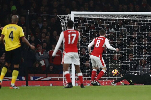Arsenal's Welsh midfielder Aaron Ramsey (2R) watches as Arsenal's Czech goalkeeper Petr Cech (R) fails to save a shot from Watford's French midfielder Younes Kaboul during the English Premier League football match between Arsenal and Watford at the Emirates Stadium in London on January 31, 2017.  / AFP / Adrian DENNIS / RESTRICTED TO EDITORIAL USE. No use with unauthorized audio, video, data, fixture lists, club/league logos or 'live' services. Online in-match use limited to 75 images, no video emulation. No use in betting, games or single club/league/player publications.  /         (Photo credit should read ADRIAN DENNIS/AFP/Getty Images)