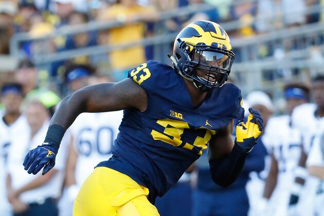 ANN ARBOR, MI - SEPTEMBER 24: Defensive end Taco Charlton #33 of the Michigan Wolverines rushes quarterback Trace McSorley #9 of the Penn State Nittany Lions during the fourth quarter of the game at Michigan Stadium on September 24, 2016 in Ann Arbor, Michigan. Michigan defeated the Penn State 49-10. (Photo by Leon Halip/Getty Images)