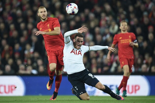 Liverpool's Estonian defender Ragnar Klavan (L) clashes with Tottenham Hotspur's Dutch striker Vincent Janssen during the EFL (English Football League) Cup fourth round match between Liverpool and Tottenham Hotspur at Anfield in Liverpool north west England on October 25, 2016. / AFP / Oli SCARFF / RESTRICTED TO EDITORIAL USE. No use with unauthorized audio, video, data, fixture lists, club/league logos or 'live' services. Online in-match use limited to 75 images, no video emulation. No use in betting, games or single club/league/player publications.  /         (Photo credit should read OLI SCARFF/AFP/Getty Images)
