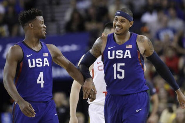 United States' Carmelo Anthony, right, celebrates after scoring, alongside teammate Jimmy Butler during the second half of an exhibition basketball game against China on Tuesday, July 26, 2016, in Oakland, Calif. The United States won 107-57. (AP Photo/Marcio Jose Sanchez)