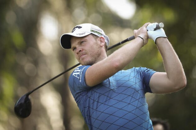 Danny Willet of England follows his shot on the sixteenth hole during the first day of Maybank Championship golf tournament in Kuala Lumpur, Malaysia on Thursday, Feb. 9, 2017. (AP Photo/Vincent Thian)