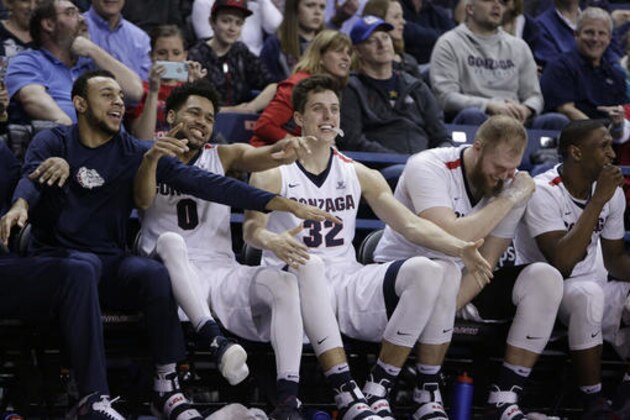 Gonzaga guard Nigel Williams-Goss, guard Silas Melson, forward Zach Collins, center Przemek Karnowski and guard Jordan Mathews, from left, celebrate on the bench during the second half of the team's NCAA college basketball game against Santa Clara in Spokane, Wash., Saturday, Feb. 4, 2017. Gonzaga won 90-55. (AP Photo/Young Kwak)