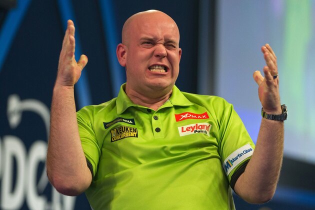 Netherlands' Michael van Gerwen celebrates after his victory in the PDC World Championship darts final over Scotland's Gary Anderson at Alexandra Palace in north London on January 2, 2017.
Michael van Gerwen beat Gary Anderson 7-3 in sets to win the final. / AFP / DANIEL LEAL-OLIVAS        (Photo credit should read DANIEL LEAL-OLIVAS/AFP/Getty Images)