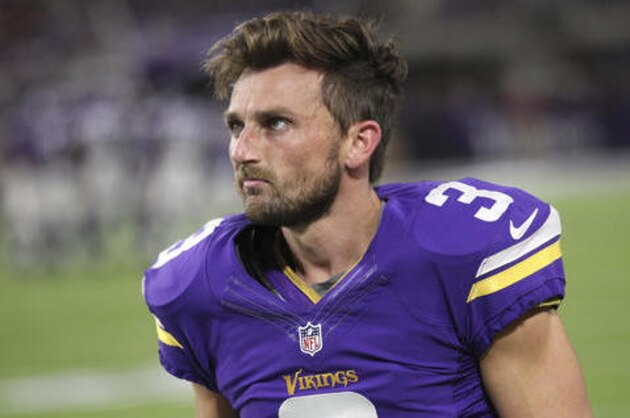 FILE - In this Oct. 3, 2016, file photo, Minnesota Vikings kicker Blair Walsh walks on the sidelines during the first half of an NFL football game against the New York Giants, in Minneapolis. Walsh has not bounced back from the devastating 27-yard miss that kept Minnesota from winning a playoff game last season. For the first time this season, his struggles directly cost the Vikings a victory, with a missed extra point and a blocked field goal in a game that was lost in overtime. (AP Photo/Andy Clayton-King, File)