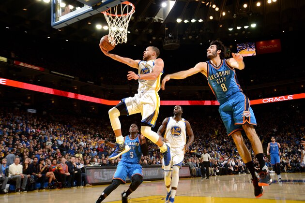 OAKLAND, CA - JANUARY 18: Stephen Curry #30 of the Golden State Warriors goes for the lay up during the game against the Oklahoma City Thunder on January 18, 2017 at ORACLE Arena in Oakland, California. NOTE TO USER: User expressly acknowledges and agrees that, by downloading and or using this photograph, user is consenting to the terms and conditions of Getty Images License Agreement. Mandatory Copyright Notice: Copyright 2017 NBAE (Photo by Noah Graham/NBAE via Getty Images)