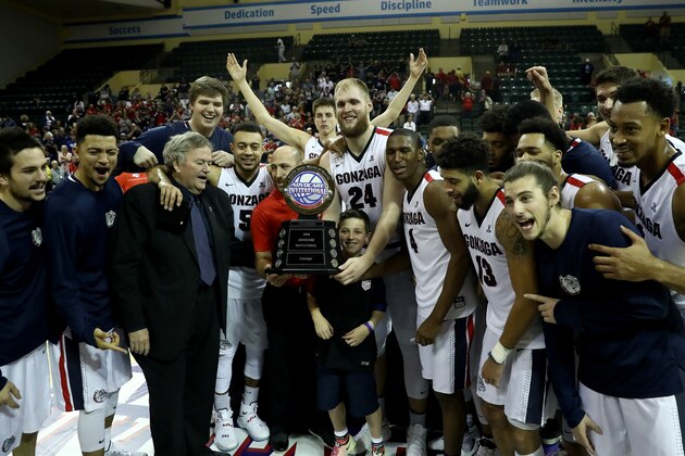 ORLANDO, FL - NOVEMBER 27:  Gonzaga Bulldogs players pose with the Advocare Invitational championship trophy following a victory over the Iowa State Cyclones at HP Field House on November 27, 2016 in Orlando, Florida.  (Photo by Sam Greenwood/Getty Images)