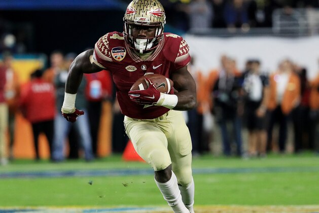 MIAMI GARDENS, FL - DECEMBER 30:  Dalvin Cook #4 of the Florida State Seminoles carries the ball in the first quarter against the Michigan Wolverines during the Capitol One Orange Bowl at Sun Life Stadium on December 30, 2016 in Miami Gardens, Florida.  (Photo by Mike Ehrmann/Getty Images)
