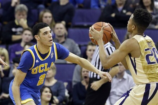 UCLA's Lonzo Ball (2) defends Washington's Markelle Fultz in an NCAA college basketball game Saturday, Feb. 4, 2017, in Seattle. UCLA won 107-66. (AP Photo/Elaine Thompson)