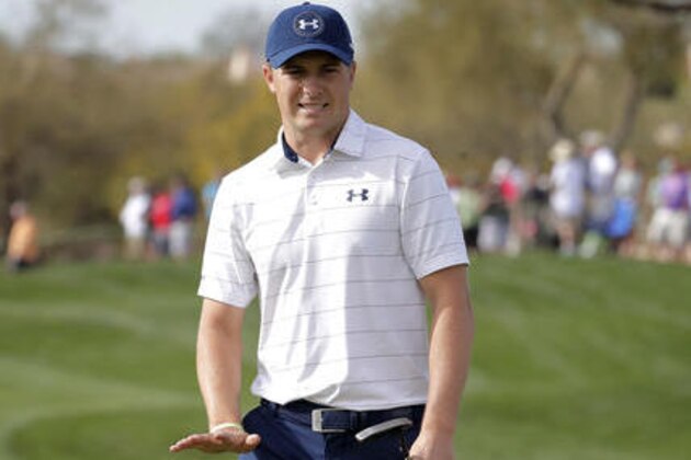 Jordan Spieth tries to get his ball to stop on the ninth green during the second round of the Waste Management Phoenix Open golf tournament, Friday, Feb. 3, 2017, in Scottsdale, Ariz. (AP Photo/Matt York)