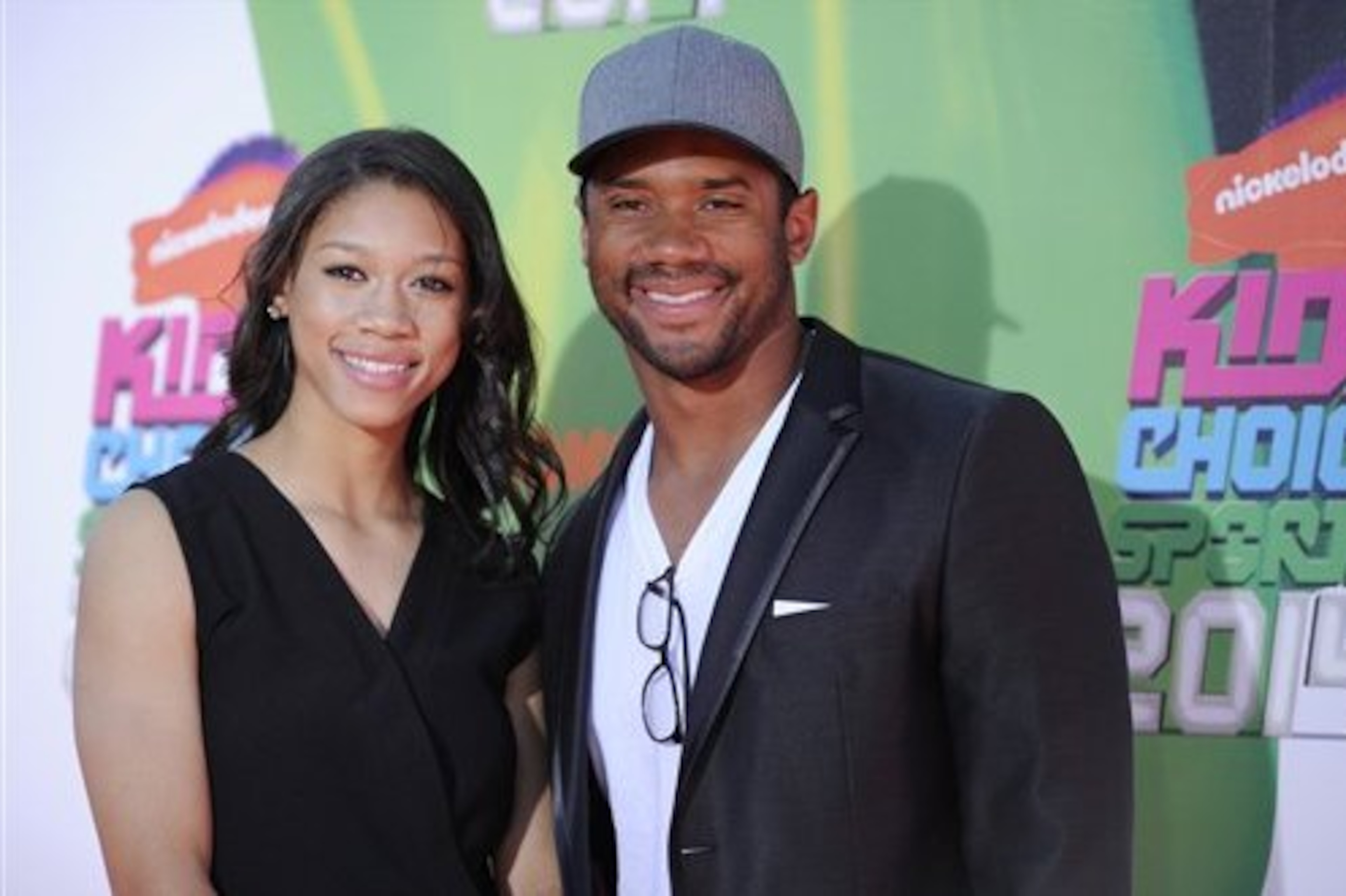 Russell Wilson, of the Seattle Seahawks, and sister Anna Wilson arrive at the Kids' Choice Sports Awards at UCLA's Pauley Pavilion on Thursday, July 17, 2014, in Los Angeles. (Photo by Chris Pizzello/Invision/AP)