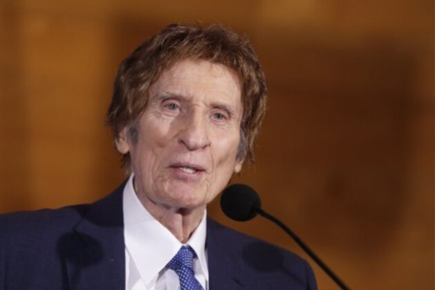 Detroit Tigers owner Mike Ilitch addresses the media during a news conference in Detroit, Friday, Nov. 14, 2014 where designated hitter Victor Martinez agreed to terms on a four-year contract through the 2018 season. (AP Photo/Carlos Osorio)
