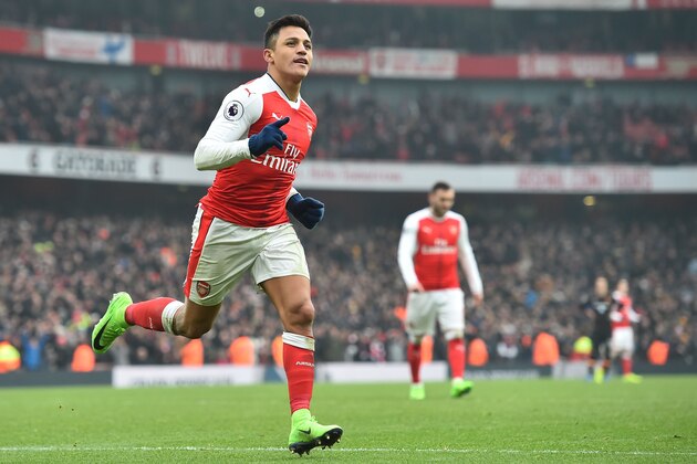 Arsenal's Chilean striker Alexis Sanchez celebrates after scoring their second goal from the penalty spot during the English Premier League football match between Arsenal and Hull City at the Emirates Stadium in London on February 11, 2017. 
Arsenal won the game 2-0. / AFP / Glyn KIRK / RESTRICTED TO EDITORIAL USE. No use with unauthorized audio, video, data, fixture lists, club/league logos or 'live' services. Online in-match use limited to 75 images, no video emulation. No use in betting, games or single club/league/player publications.  /         (Photo credit should read GLYN KIRK/AFP/Getty Images)