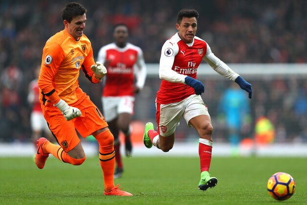 LONDON, ENGLAND - FEBRUARY 11:  Alexis Sanchez of Arsenal tries to go past Eldin Jakupovic of Hull City during the Premier League match between Arsenal and Hull City at Emirates Stadium on February 11, 2017 in London, England.  (Photo by Clive Rose/Getty Images)