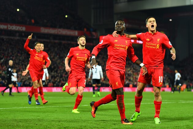 LIVERPOOL, ENGLAND - FEBRUARY 11:  Sadio Mane (2nd R) of Liverpool celebrates scoring his side's second goal with his team mate Philippe Coutinho (1st R) during the Premier League match between Liverpool and Tottenham Hotspur at Anfield on February 11, 2017 in Liverpool, England.  (Photo by Mike Hewitt/Getty Images)