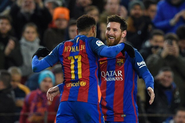 Barcelona's Argentinian forward Lionel Messi celebrates with Barcelona's Brazilian forward Neymar (L) after scoring a goal during the Spanish Copa del Rey (King's Cup) round of 16 second leg football match FC Barcelona vs Athletic Club de Bilbao at the Camp Nou stadium in Barcelona on January 11, 2017. / AFP / LLUIS GENE        (Photo credit should read LLUIS GENE/AFP/Getty Images)