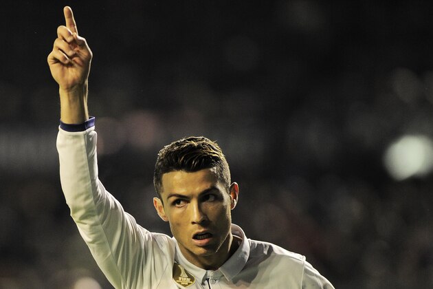 Real Madrid's Portuguese forward Cristiano Ronaldo celebrates after scoring his team's first goal during the Spanish league football match CA Osasuna vs Real Madrid CF at El Sadar stadium in Pamplona on February 11, 2017. / AFP / ANDER GILLENEA        (Photo credit should read ANDER GILLENEA/AFP/Getty Images)