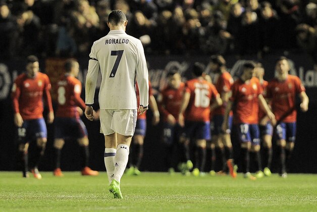 Real Madrid's Portuguese forward Cristiano Ronaldo walks after a goal by Osasuna during the Spanish league football match CA Osasuna vs Real Madrid CF at El Sadar stadium in Pamplona on February 11, 2017. / AFP / ANDER GILLENEA        (Photo credit should read ANDER GILLENEA/AFP/Getty Images)