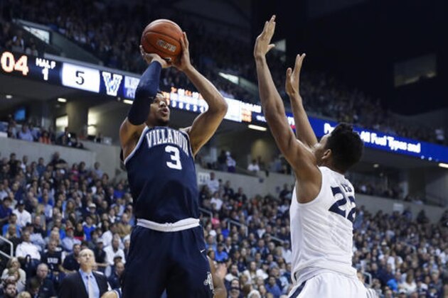 Villanova's Josh Hart (3) shoots over Xavier's Kaiser Gates (22) in the first half of an NCAA college basketball game, Saturday, Feb. 11, 2017, in Cincinnati. (AP Photo/John Minchillo)