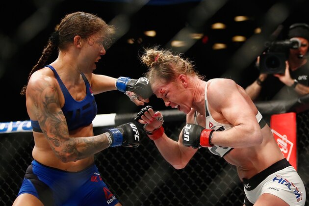 NEW YORK, NY - FEBRUARY 11:  (L-R) Germaine de Randamie of The Netherlands throws a punch against Holly Holm of United States in their UFC women's featherweight championship bout during UFC 208 at the Barclays Center on February 11, 2017 in the Brooklyn Borough of New York City.  (Photo by Anthony Geathers/Getty Images)