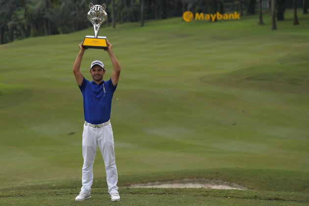 Fabrizio Zanotti of Paraguay poses with his trophy after winning the final round of the 2017 Maybank Malaysia Championship golf tournament at Saujana Golf and Country Club outside Kuala Lumpur on February 12, 2017. / AFP / MOHD RASFAN        (Photo credit should read MOHD RASFAN/AFP/Getty Images)