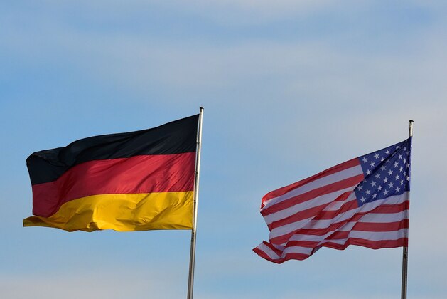 The flags of Germany (L) and the US flutter at the Chancellery in Berlin, where the German Chancellor is expected to meet the US President paying his farewell visit to the German capital on November 17, 2016.
US President Barack Obama is to meet German Chancellor Angela Merkel, widely seen as the new standard bearer of liberal democracy since the election of Donald Trump. On the last leg of his final European tour as president, Obama will underline shared values, try to ease fears about the future of the transatlantic partnership and thank Merkel for her friendship during his two terms, White House officials said.
 / AFP / TOBIAS SCHWARZ        (Photo credit should read TOBIAS SCHWARZ/AFP/Getty Images)