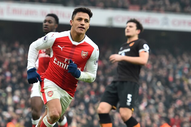 Arsenal's Chilean striker Alexis Sanchez celebrates after scoring their second goal from the penalty spot during the English Premier League football match between Arsenal and Hull City at the Emirates Stadium in London on February 11, 2017. 
Arsenal won the game 2-0. / AFP / Glyn KIRK / RESTRICTED TO EDITORIAL USE. No use with unauthorized audio, video, data, fixture lists, club/league logos or 'live' services. Online in-match use limited to 75 images, no video emulation. No use in betting, games or single club/league/player publications.  /         (Photo credit should read GLYN KIRK/AFP/Getty Images)