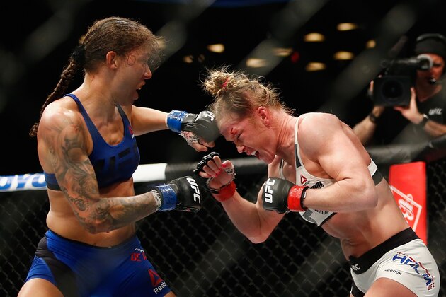 NEW YORK, NY - FEBRUARY 11:  (L-R) Germaine de Randamie of The Netherlands throws a punch against Holly Holm of United States in their UFC women's featherweight championship bout during UFC 208 at the Barclays Center on February 11, 2017 in the Brooklyn Borough of New York City.  (Photo by Anthony Geathers/Getty Images)