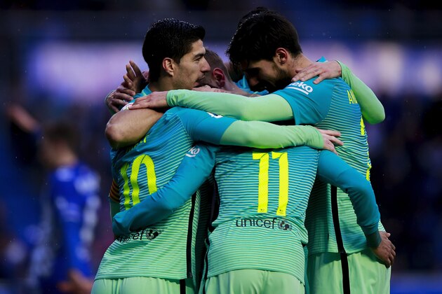 VITORIA-GASTEIZ, SPAIN - FEBRUARY 11:  Lionel Messi (L) of FC Barcelona celebrates scoring their third goal with teammates Luis Suarez (L), Neymar JR. (2ndR) and Andre Gomes (R) during the La Liga match between Deportivo Alaves and FC Barcelona at Estadio de Mendizorroza on February 11, 2017 in Vitoria-Gasteiz, Spain.  (Photo by Gonzalo Arroyo Moreno/Getty Images)