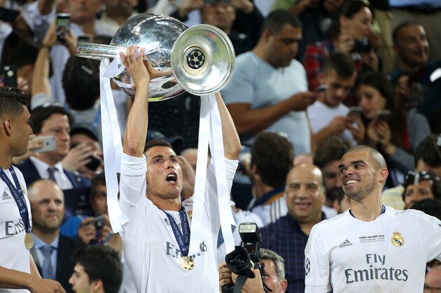 MILAN, ITALY - MAY 28: Cristiano Ronaldo of Real Madrid holds the cup during the trophy ceremony following winning the UEFA Champions League final between Real Madrid and Club Atletico Madrid at Stadio Giuseppe Meazza, San Siro on May 28, 2016 in Milan, Italy. (Photo by Jean Catuffe/Getty Images)
