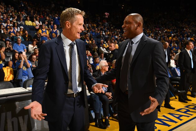 OAKLAND, CA - OCTOBER 4:  Head Coach Steve Kerr of the Golden State Warriors talks with Head Coach Doc Rivers of the Los Angeles Clippers before a preseason game on October 4, 2016 at Oracle Arena in Oakland, California. NOTE TO USER: User expressly acknowledges and agrees that, by downloading and or using this photograph, user is consenting to the terms and conditions of Getty Images License Agreement. Mandatory Copyright Notice: Copyright 2016 NBAE (Photo by Garrett Ellwood/NBAE via Getty Images)