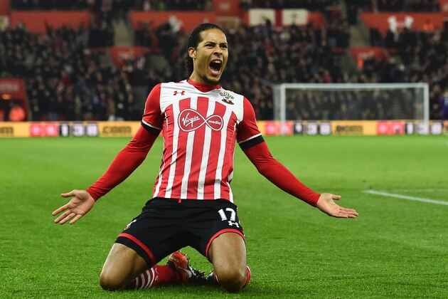 Southampton's Dutch defender Virgil van Dijk celebrates scoring the opening goal during the English Premier League football match between Southampton and Tottenham Hotspur at St Mary's Stadium in Southampton, southern England on December 28, 2016. / AFP / Glyn KIRK / RESTRICTED TO EDITORIAL USE. No use with unauthorized audio, video, data, fixture lists, club/league logos or 'live' services. Online in-match use limited to 75 images, no video emulation. No use in betting, games or single club/league/player publications.  /         (Photo credit should read GLYN KIRK/AFP/Getty Images)