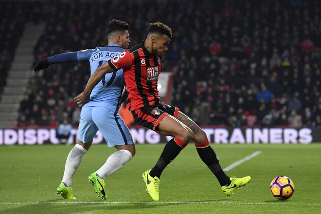 BOURNEMOUTH, ENGLAND - FEBRUARY 13:  Tyrone Mings of Bournemouth battles for the ball with Sergio Aguero of Manchester City during the Premier League match between AFC Bournemouth and Manchester City at Vitality Stadium on February 13, 2017 in Bournemouth, England.  (Photo by Stu Forster/Getty Images)