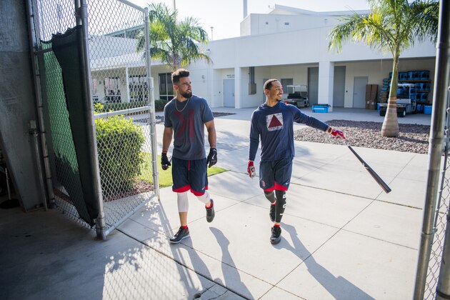 FORT MYERS, FL - FEBRUARY 13: Mookie Betts #50 and Deven Marrero #17 of the Boston Red Sox walk into the batting cages on February 13, 2017 at jetBlue Park in Fort Myers, Florida.   (Photo by Michael Ivins/Boston Red Sox) *** LOCAL CAPTION ***  Mookie Betts;Deven Marrero