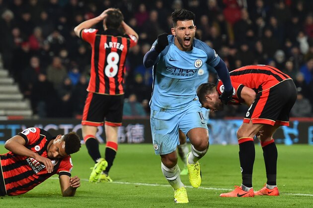 Manchester City's Argentinian striker Sergio Aguero (2nd R) celebrates after scoring their second goal during the English Premier League football match between Bournemouth and Manchester City at the Vitality Stadium in Bournemouth, southern England on February 13, 2017. / AFP / Glyn KIRK / RESTRICTED TO EDITORIAL USE. No use with unauthorized audio, video, data, fixture lists, club/league logos or 'live' services. Online in-match use limited to 75 images, no video emulation. No use in betting, games or single club/league/player publications.  /         (Photo credit should read GLYN KIRK/AFP/Getty Images)