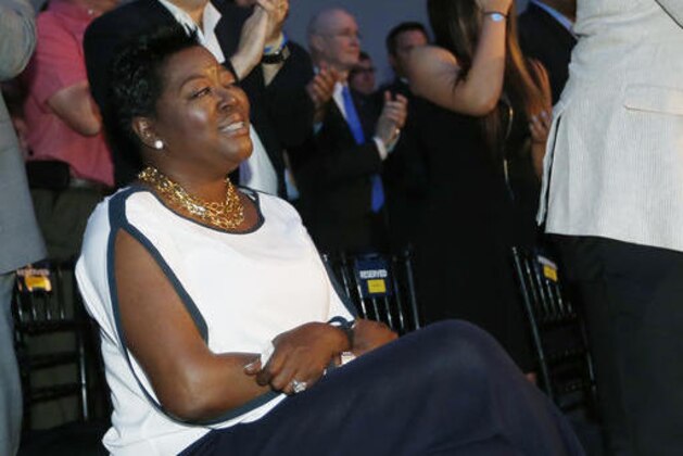 FILE - In this May 6, 2014 file photo, Wanda Pratt, Kevin Durant's mother, receives a standing ovation during a news conference as Durant gives his acceptance speech for winning 2013-14 Kia NBA Basketball Most Value Player Award in Oklahoma City. In an emotional tribute, Durant thanked his mother for her sacrifices as he and his brother grew up in Washington, D.C. Durant's mother, Wanda, is the subject of a Lifetime original movie called The Real MVP: The Wanda Durant Story, which will premiere on May 7.(AP Photo/Sue Ogrocki)