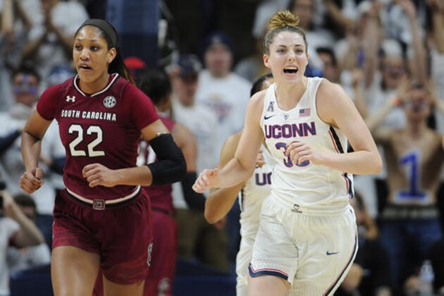 Connecticut's Katie Lou Samuelson reacts after a UConn basket as she runs up court with South Carolina's A'ja Wilson, left, in the first half of an NCAA college basketball game, Monday, Feb. 13, 2017, in Storrs, Conn. (AP Photo/Jessica Hill)