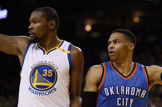 OAKLAND, CA - JANUARY 18:  Kevin Durant #35 of the Golden State Warriors and Russell Westbrook #0 of the Oklahoma City Thunder point in different directions after the ball went out of bounds at ORACLE Arena on January 18, 2017 in Oakland, California.  NOTE TO USER: User expressly acknowledges and agrees that, by downloading and or using this photograph, User is consenting to the terms and conditions of the Getty Images License Agreement.  (Photo by Ezra Shaw/Getty Images)