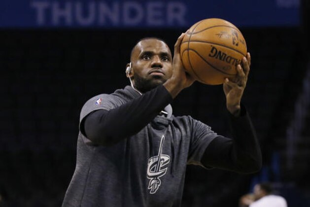 Cleveland Cavaliers forward LeBron James warms up for the team's NBA basketball game against the Oklahoma City Thunder in Oklahoma City, Thursday, Feb. 9, 2017. (AP Photo/Sue Ogrocki)