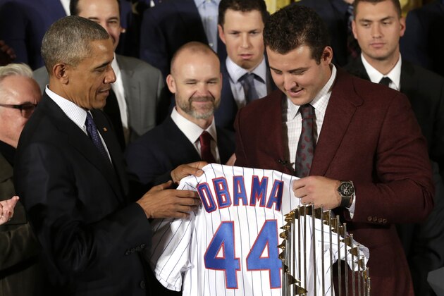 US President Barack Obama is presented a jersey from Anthony Rizzo(R) as he welcomes the World Champion Chicago Cubs baseball team to the White House in Washington, DC on January 16, 2017. / AFP / YURI GRIPAS        (Photo credit should read YURI GRIPAS/AFP/Getty Images)