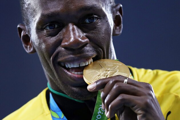 RIO DE JANEIRO, BRAZIL - AUGUST 20:  Gold medalist Usain Bolt of Jamaica stands on the podium during the medal ceremony for the Men's 4 x 100 meter Relay on Day 15 of the Rio 2016 Olympic Games at the Olympic Stadium on August 20, 2016 in Rio de Janeiro, Brazil.  (Photo by Patrick Smith/Getty Images)