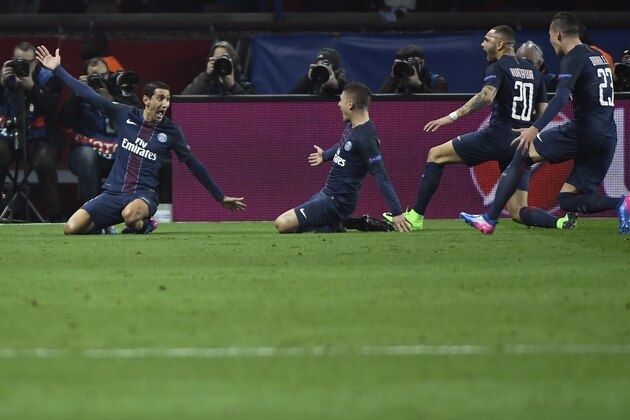 Paris Saint-Germain's Argentinian forward Angel Di Maria (L) celebrates with teammates after scoring a goal during the UEFA Champions League round of 16 first leg football match between Paris Saint-Germain and FC Barcelona on February 14, 2017 at the Parc des Princes stadium in Paris. / AFP / Lionel BONAVENTURE        (Photo credit should read LIONEL BONAVENTURE/AFP/Getty Images)