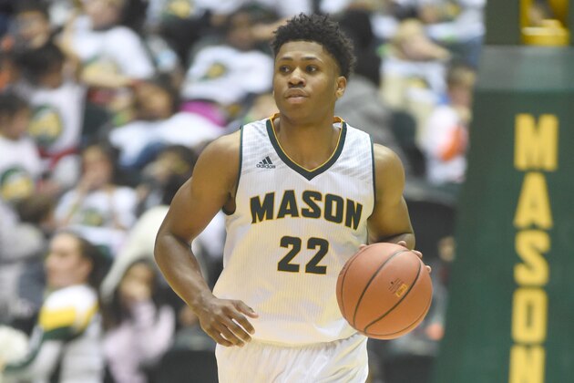 FAIRFAX, VA - DECEMBER 22:  Marquise Moore #22 of the George Mason Patriots dribbles up court during a college basketball game against the Prairie View A&M Panthers at the Eagle Bank Arena on December 22, 2016 in Fairfax, Virginia.  The Patriots won 75-59.  (Photo by Mitchell Layton/Getty Images)