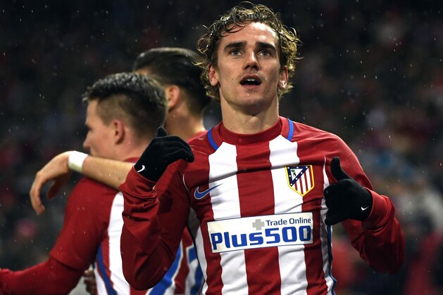 Atletico Madrid's French forward Antoine Griezmann celebrates after scoring a goal during the Spanish league football match Club Atletico de Madrid vs RC Celta de Vigo at the Vicente Calderon stadium in Madrid on February 12, 2017. / AFP / CURTO DE LA TORRE        (Photo credit should read CURTO DE LA TORRE/AFP/Getty Images)