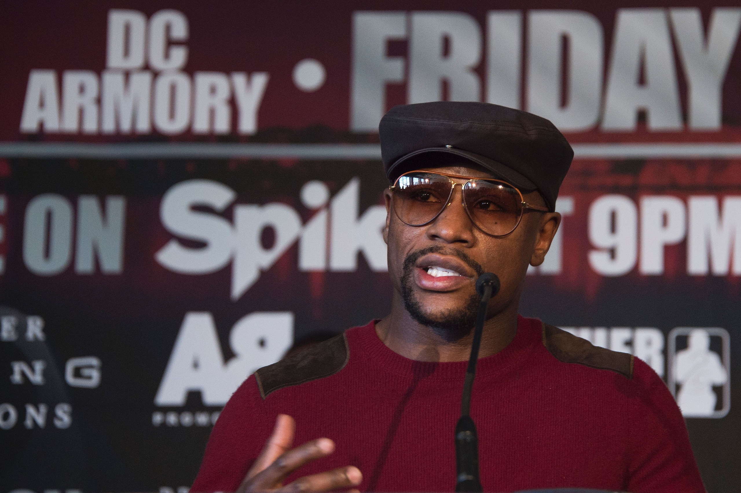 Promoter and former champion boxer Floyd Mayweather (C) speaks during a press conference announcing WBA super lightweight champion Adrien Broner's fight against Ashley Theophane, in Washington, DC, February 29, 2016.  
The title contest is scheduled to take place April 1, 2016 at the D.C. Armory in Washington DC. / AFP / JIM WATSON        (Photo credit should read JIM WATSON/AFP/Getty Images)