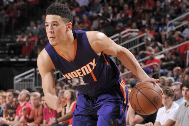 HOUSTON, TX - FEBRUARY 11:  Devin Booker #1 of the Phoenix Suns handles the ball against the Houston Rockets on February 11, 2017 at the Toyota Center in Houston, Texas. NOTE TO USER: User expressly acknowledges and agrees that, by downloading and or using this photograph, User is consenting to the terms and conditions of the Getty Images License Agreement. Mandatory Copyright Notice: Copyright 2017 NBAE (Photo by Bill Baptist/NBAE via Getty Images)