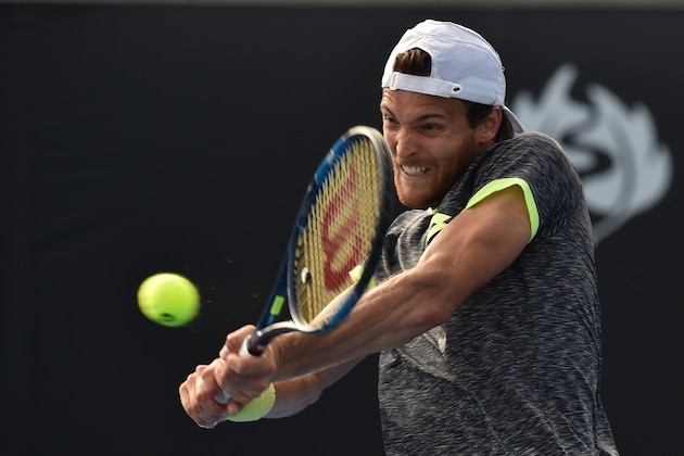 Portugal's Joao Sousa hits a return against Australia's Jordan Thompson during their men's singles match on day two of the Australian Open tennis tournament in Melbourne on January 17, 2017. / AFP / PAUL CROCK / IMAGE RESTRICTED TO EDITORIAL USE - STRICTLY NO COMMERCIAL USE        (Photo credit should read PAUL CROCK/AFP/Getty Images)