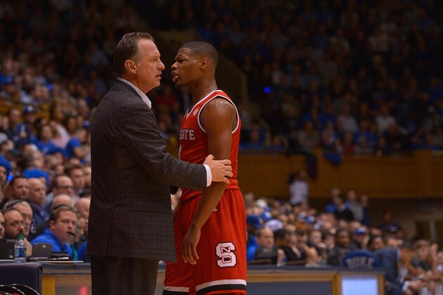 DURHAM, NC - JANUARY 23:  Head coach Mark Gottfried of the North Carolina State Wolfpack talks with Dennis Smith Jr. #4 of the North Carolina State Wolfpack during their win against the Duke Blue Devils at Cameron Indoor Stadium on January 23, 2017 in Durham, North Carolina. North Carolina State won 84-82.  (Photo by Grant Halverson/Getty Images)