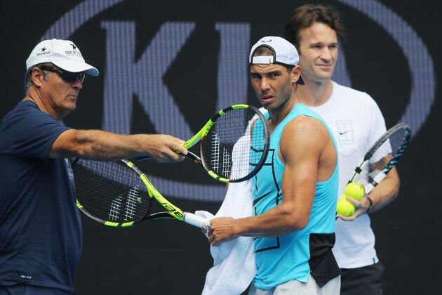 MELBOURNE, AUSTRALIA - JANUARY 15:  Raphael Nadal of Spain listens to coaches Tony Nadal (L) and Carlos Moya during a practice session ahead of the 2017 Australian Open at Melbourne Park on January 15, 2017 in Melbourne, Australia.  (Photo by Michael Dodge/Getty Images)