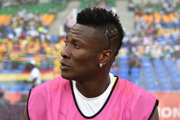 Ghana's forward Asamoah Gyan who is recovering from an injury sits on the bench during the 2017 Africa Cup of Nations quarter-final football match between DR Congo and Ghana in Oyem on January 29, 2017. / AFP / ISSOUF SANOGO        (Photo credit should read ISSOUF SANOGO/AFP/Getty Images)